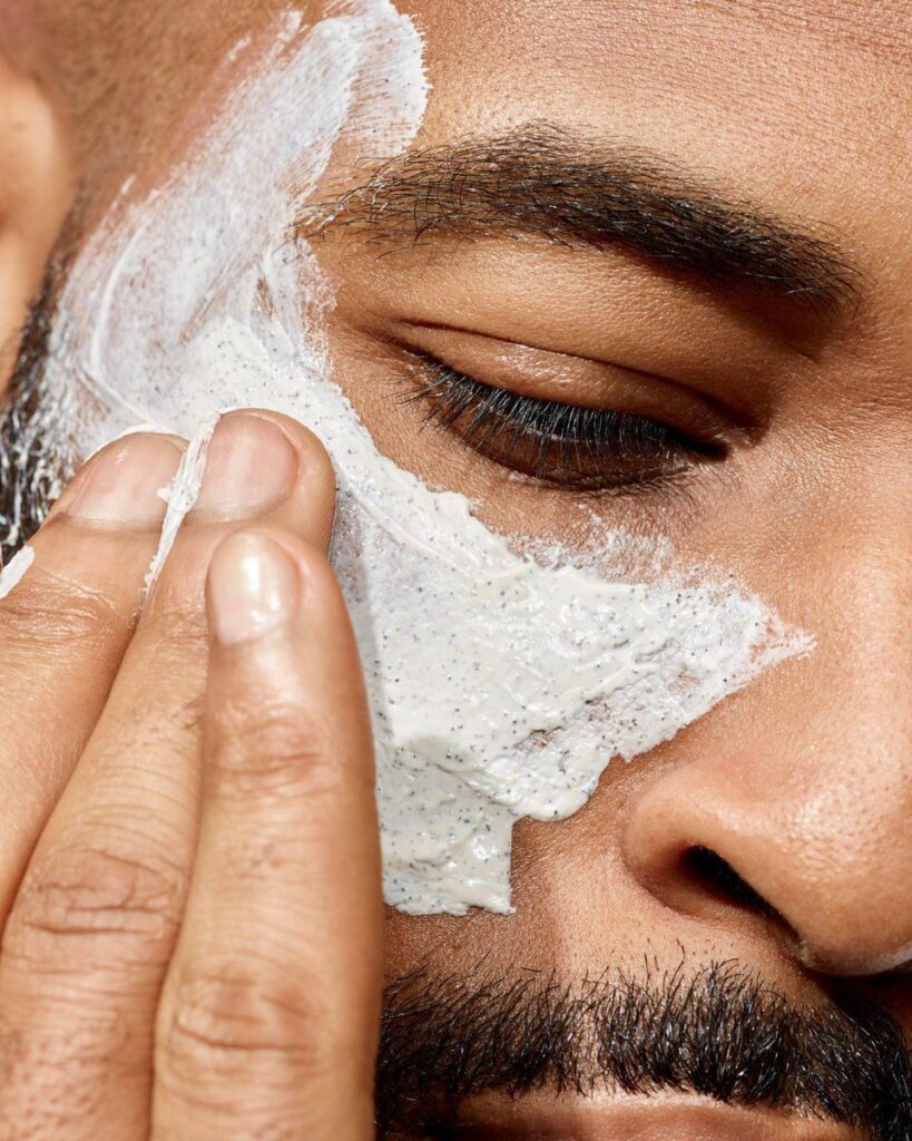 men cleansing face
